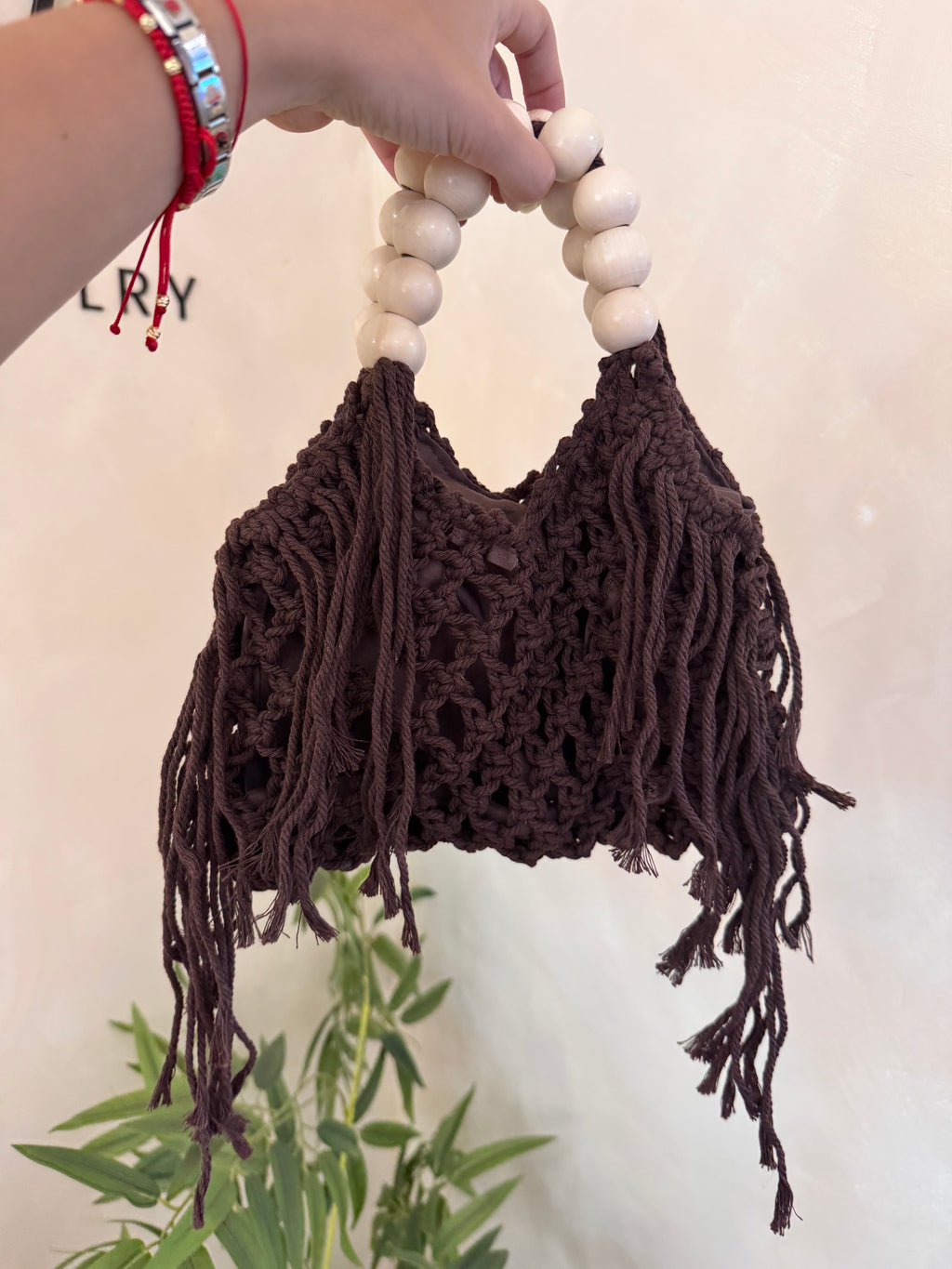 Bolso de mano tejido marrón